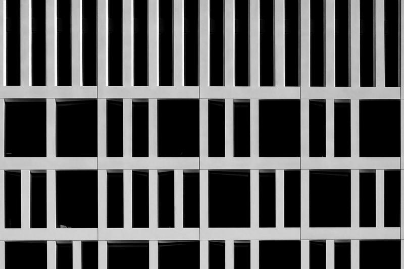 The ordered grid of a concrete office facade