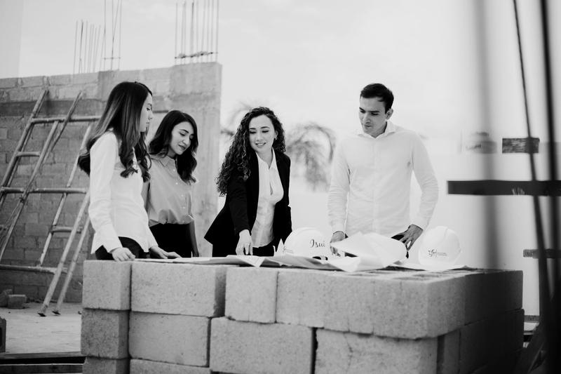 A team reviewing drawings on site