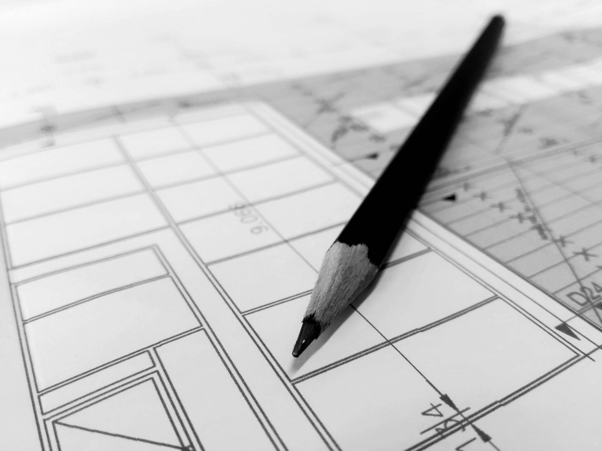 A pencil resting on a technical drawing