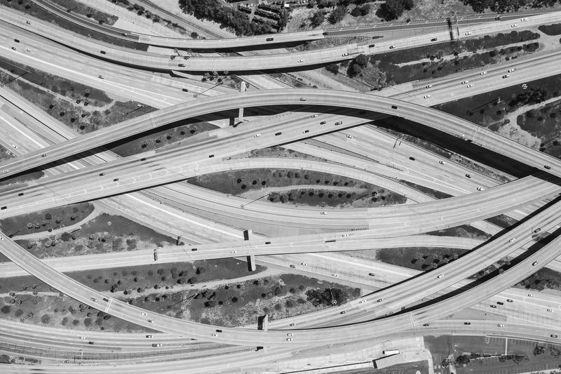 Aerial view of curving highway interchanges