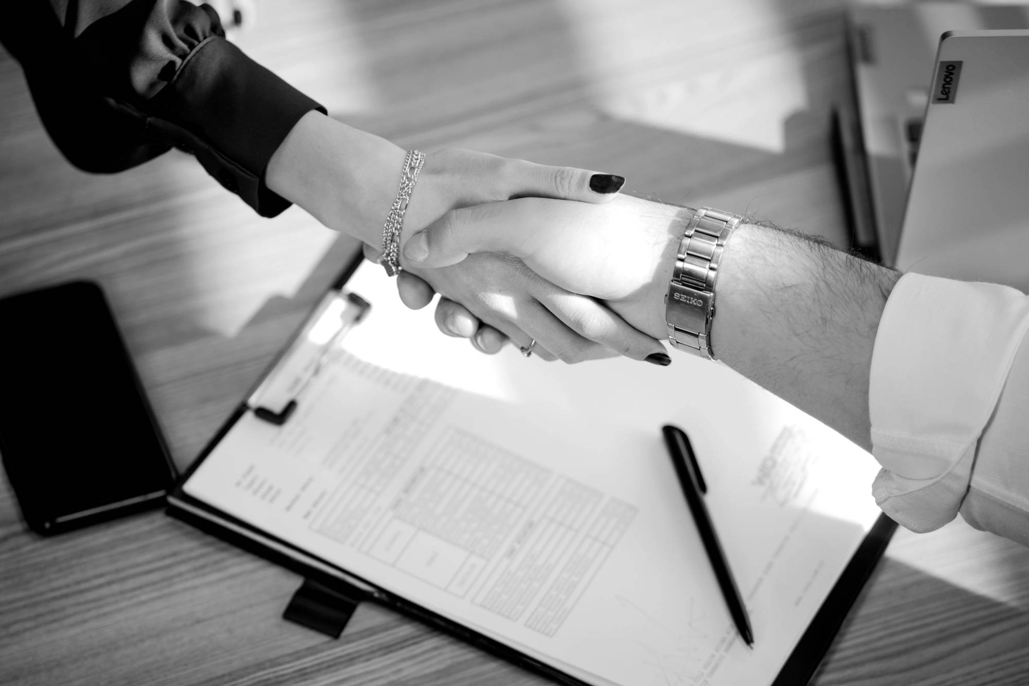 A handshake over a signed agreement